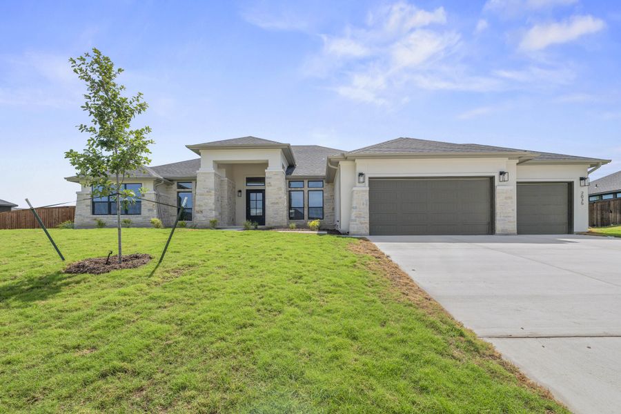 Front exterior of a new home in Bella Charca, Nolanville, TX, highlighting curb appeal (Image 1). Front exterior of a new home in Bella Charca, Nolanville, TX, highlighting curb appeal (Image 1).