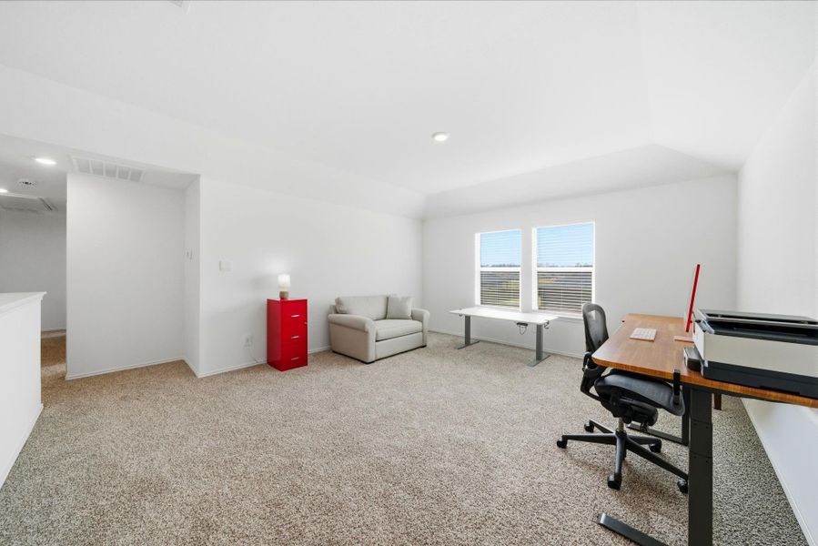 Open upstairs game room with plenty of space for play and entertainment.