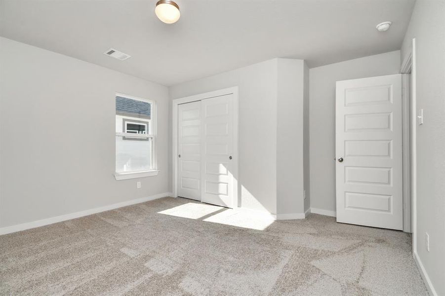 Generously sized secondary bedrooms, complete with spacious closets and soft, inviting carpeting. Enjoy abundant natural light streaming in through the large windows, complemented by privacy blinds for your personal sanctuary.