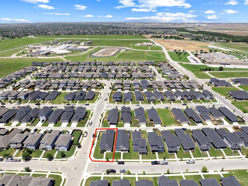 Aerial perspective of suburban area with property boundaries highlighted Aerial perspective of suburban area with property boundaries highlighted