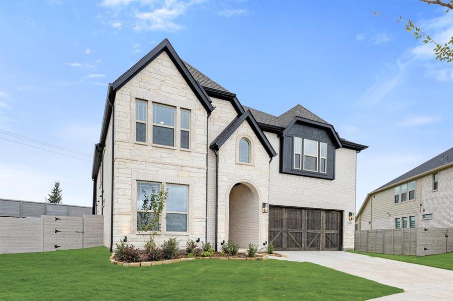 Front exterior of a new home in Painted Tree Woodland District 50, McKinney, TX, highlighting curb appeal (Image 19). Front exterior of a new home in Painted Tree Woodland District 50, McKinney, TX, highlighting curb appeal (Image 19).