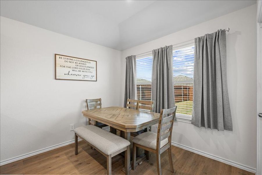 Dining area with wood finished floors Dining area with wood finished floors