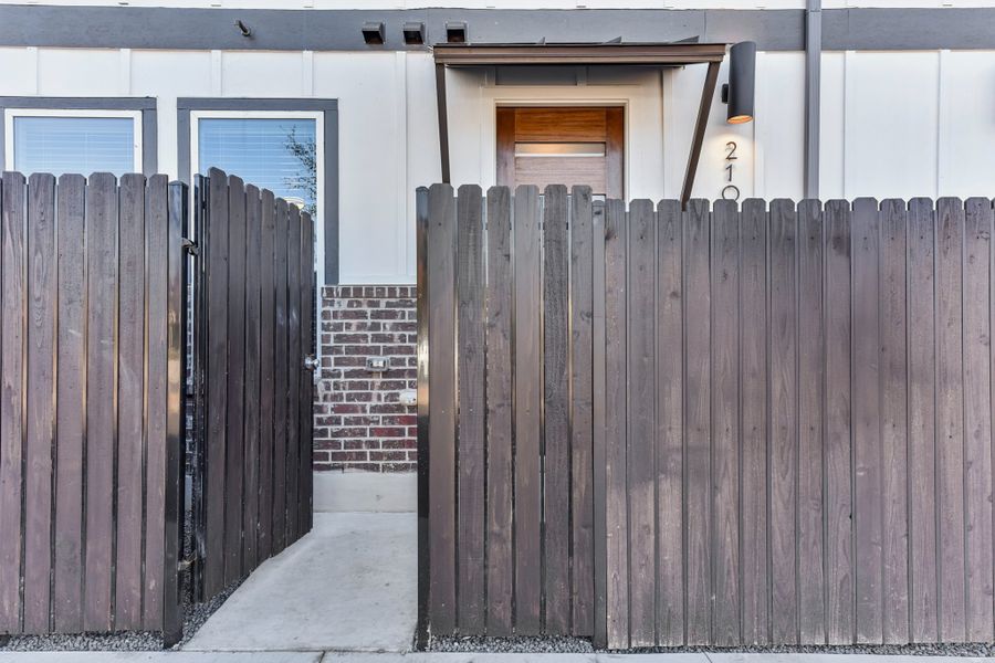 Exterior details and patio area of a home in Koenig Townhomes, Austin (Image 4).