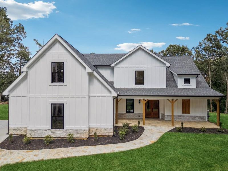 Front exterior of a new home in , Woodstock, GA, highlighting curb appeal (Image 2).