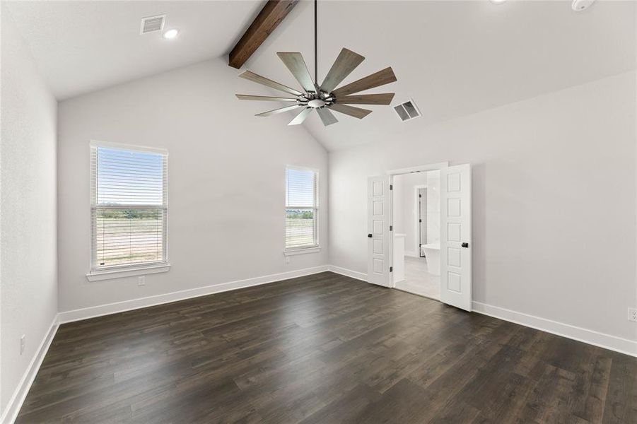 Unfurnished room featuring dark wood finished floors, beamed ceiling, recessed lighting, ceiling fan, and high vaulted ceiling Unfurnished room featuring dark wood finished floors, beamed ceiling, recessed lighting, ceiling fan, and high vaulted ceiling