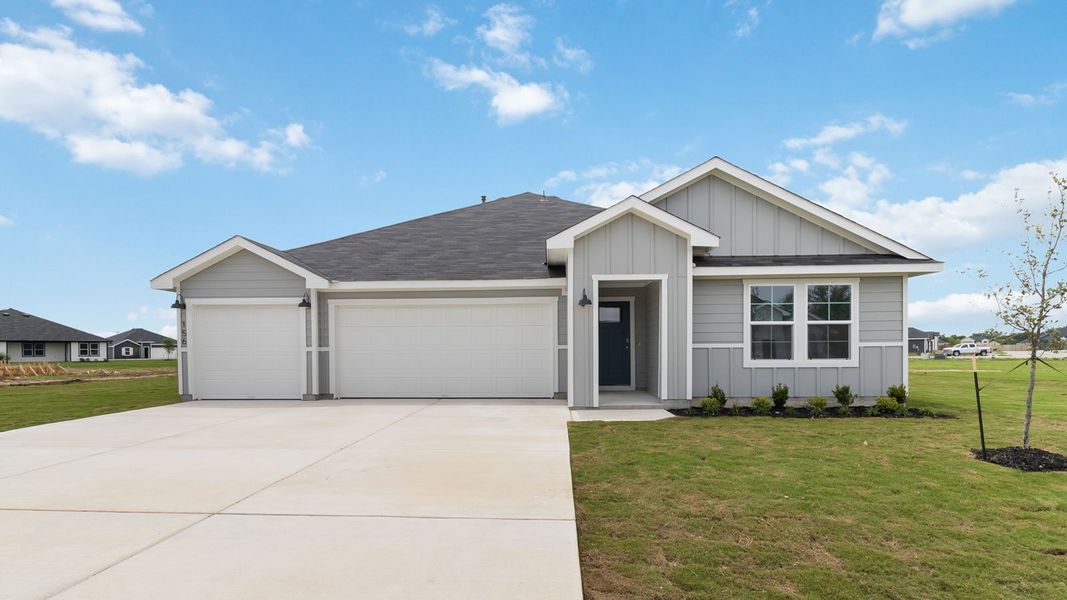 Front exterior of a new home in Railhead, Cedar Creek, TX, highlighting curb appeal (Image 1). Front exterior of a new home in Railhead, Cedar Creek, TX, highlighting curb appeal (Image 1).
