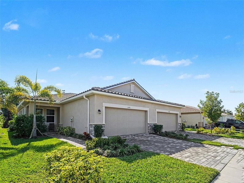 Front exterior of a new home in , Venice, FL, highlighting curb appeal (Image 22).