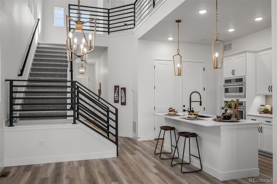 Furnished interior view inside a new home in Revel Crossing at Wolf Ranch - The Panorama Collection, Colorado Springs (Image 11).