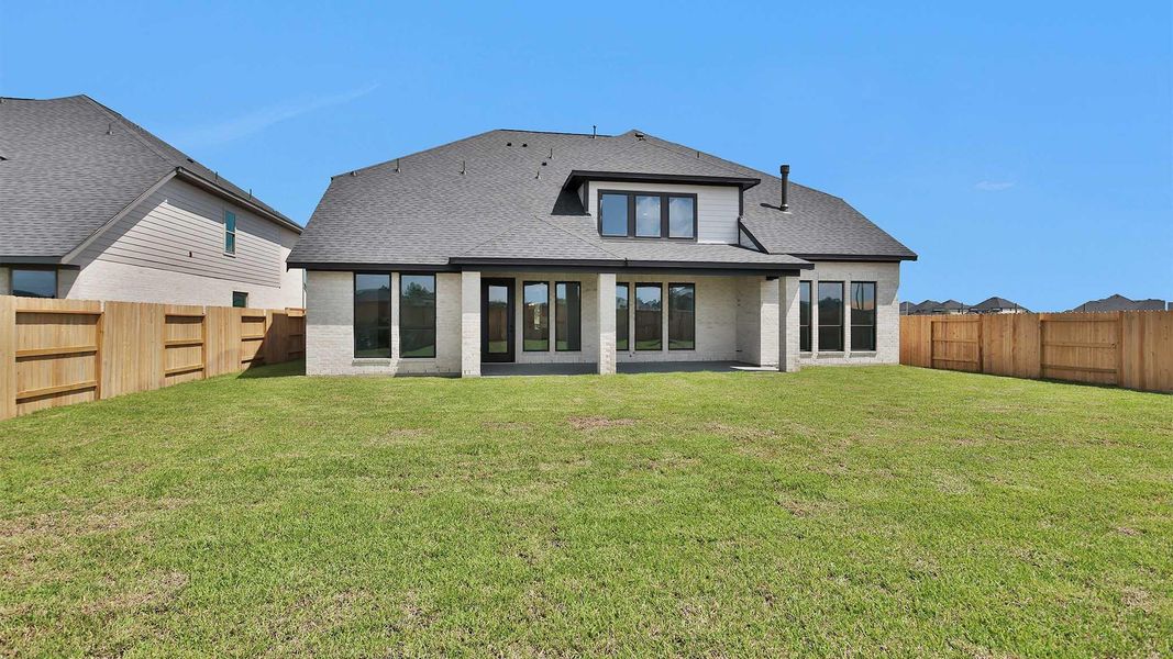Exterior details and patio area of a home in Legacy Prairie at Katy Court, Katy (Image 3).