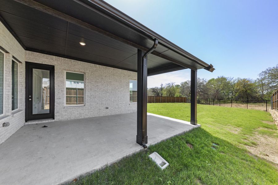 Exterior details and patio area of a home in The Reserve at Spiritas Ranch, Little Elm (Image 3). Exterior details and patio area of a home in The Reserve at Spiritas Ranch, Little Elm (Image 3).