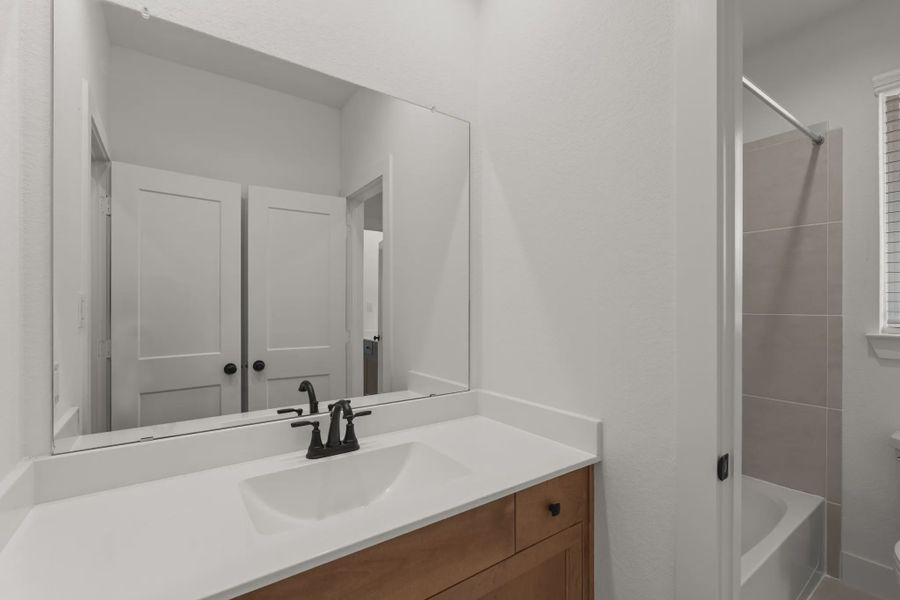 Representative furnished interior of a home built from the Sorenstam by Chesmar Homes in Riceland Alley Loads, Mont Belvieu (Image 54).