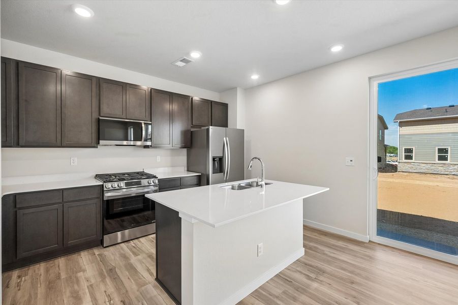 A kitchen with a large island.
