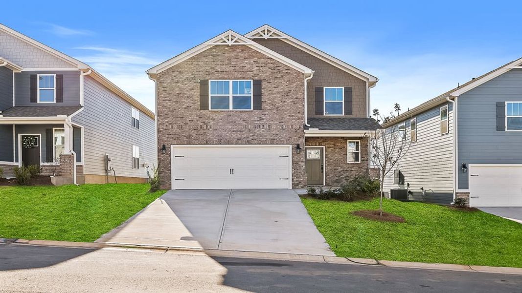 Front exterior of a new home in Adams Glen, Mauldin, SC, highlighting curb appeal (Image 1).