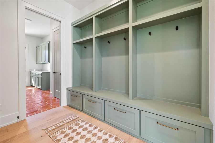 Mudroom with light wood-style flooring