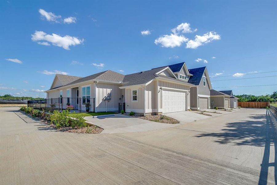 Front exterior of a new home in , Granbury, TX, highlighting curb appeal (Image 23). Front exterior of a new home in , Granbury, TX, highlighting curb appeal (Image 23).
