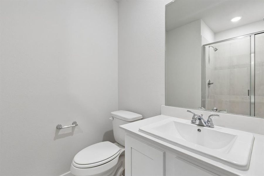 Bathroom in the Oscar home plan by Trophy Signature Homes – REPRESENTATIVE PHOTO