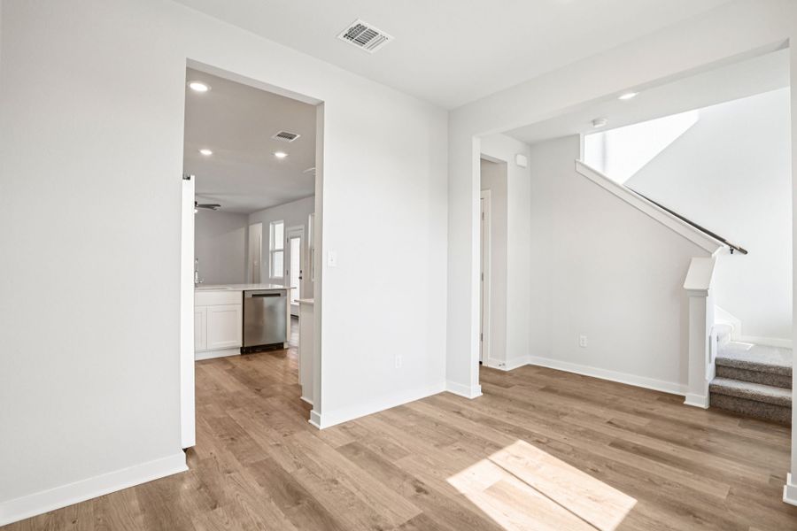 A room with a wood floor and a wood floor.