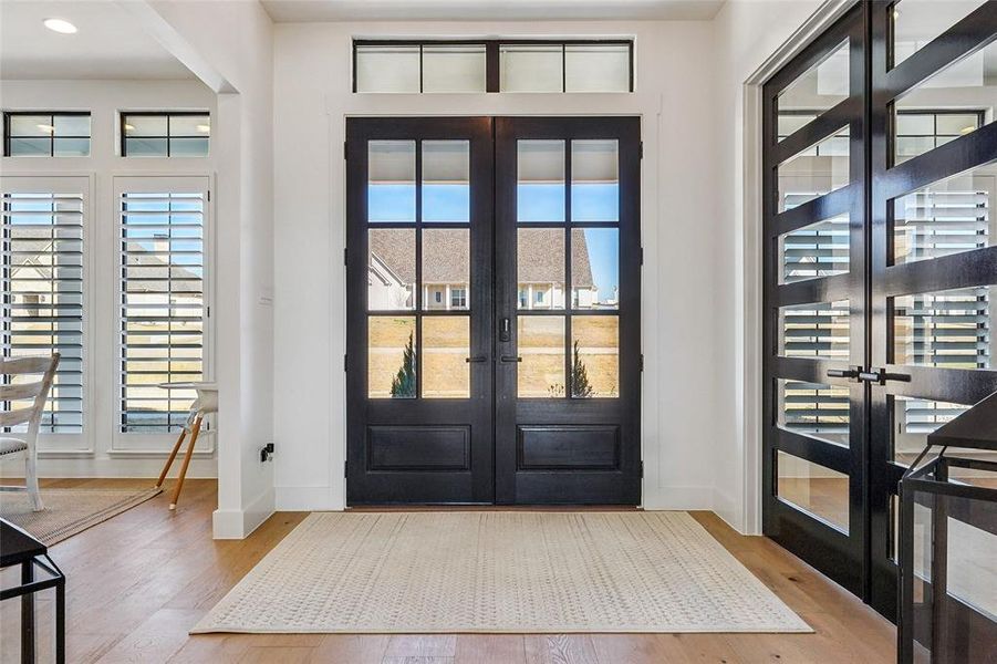 Beautiful front doors frame the home perfectly!