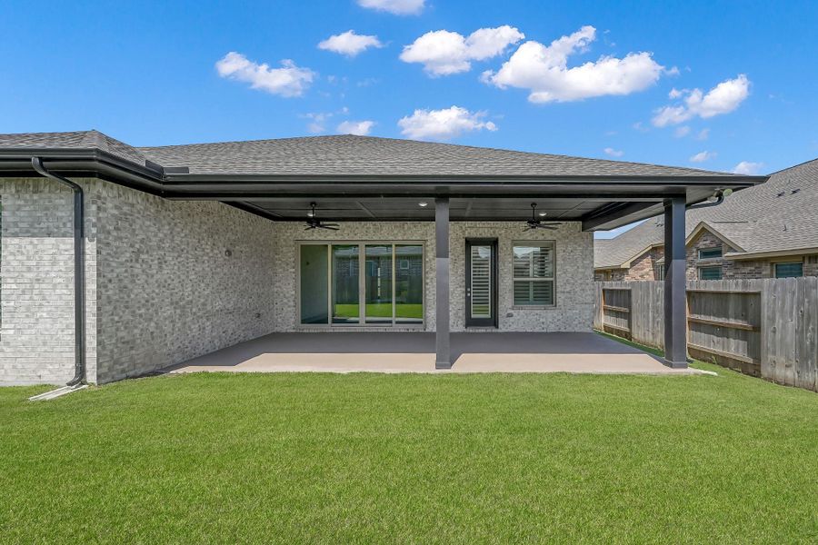 Front exterior of a new home in The Meadows at Imperial Oaks, Conroe, TX, highlighting curb appeal (Image 21). Front exterior of a new home in The Meadows at Imperial Oaks, Conroe, TX, highlighting curb appeal (Image 21).