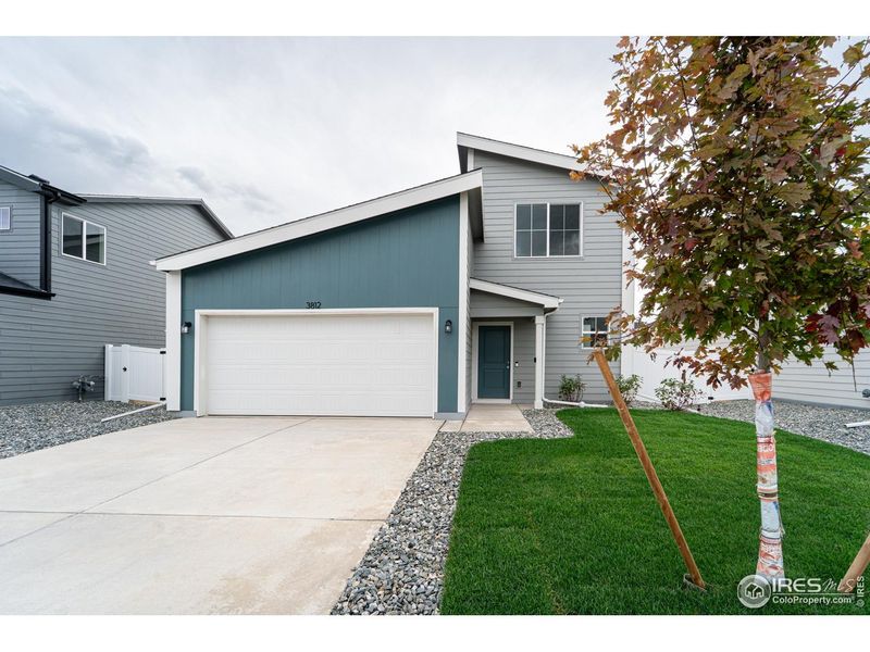 Front exterior of a new home in Liberty Draw, Evans, CO, highlighting curb appeal (Image 1). Front exterior of a new home in Liberty Draw, Evans, CO, highlighting curb appeal (Image 1).