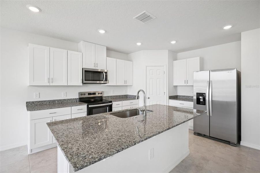 Furnished interior view inside a new home in Villamar - Signature Series, Winter Haven (Image 4).