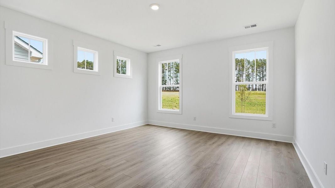 Primary suite that offers first-rate relaxation with established style and elevated finishes