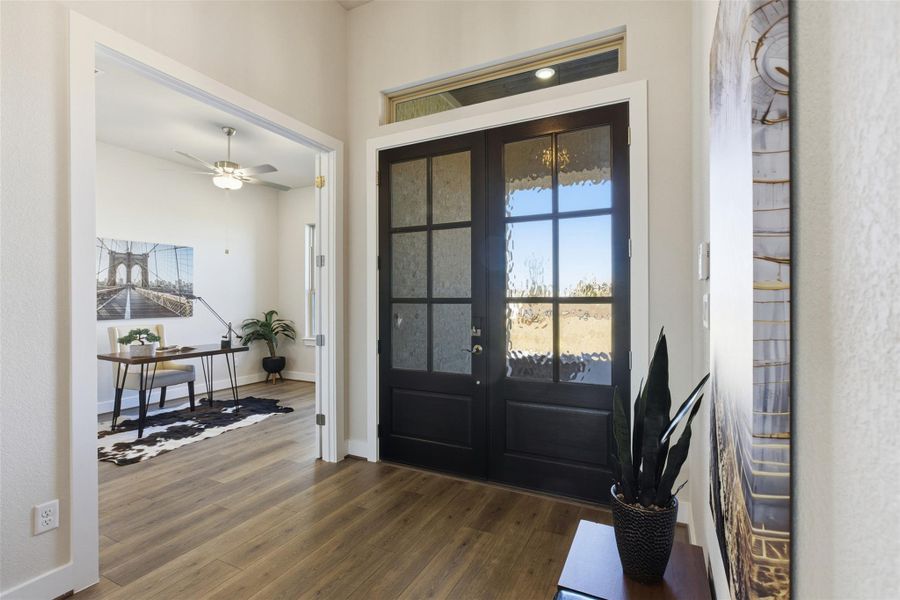 Entrance foyer featuring dark wood finished floors and ceiling fan