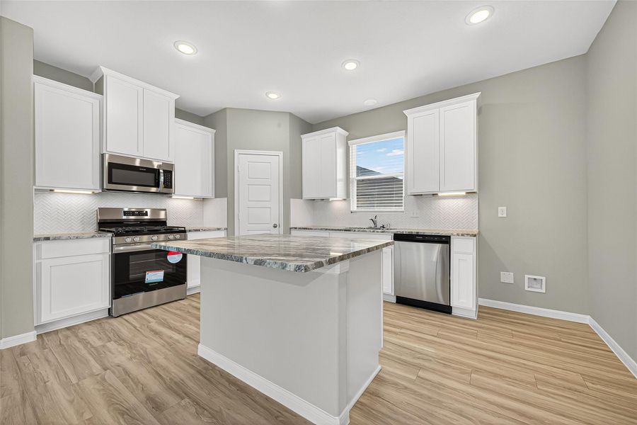 Furnished interior view inside a new home in Sunterra, Katy (Image 17).