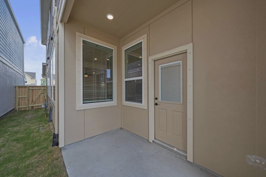 Representative exterior details of a home built from the Versailles by Chesmar Homes in Meridiana Chateau, Manvel (Image 31).