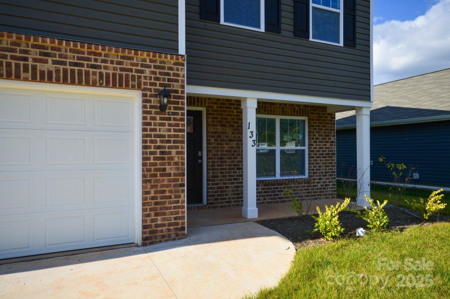 Exterior details and patio area of a home in Wildbrook Village, Waynesville (Image 2).