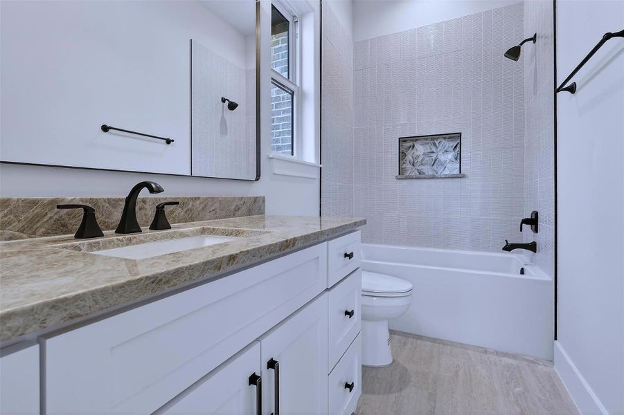 Private ensuite bathroom! High-end finishes elevate everyday functionality.