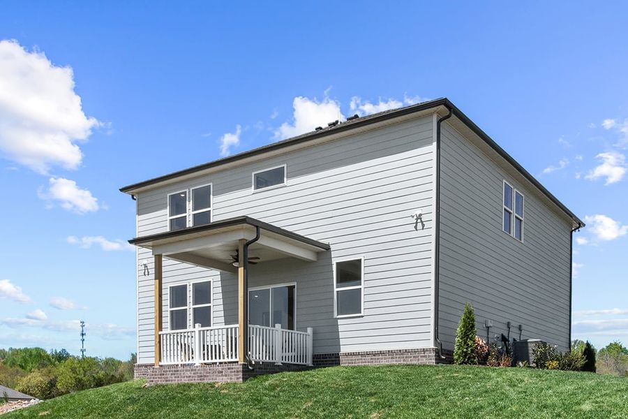 A house with a grass yard. A house with a grass yard.
