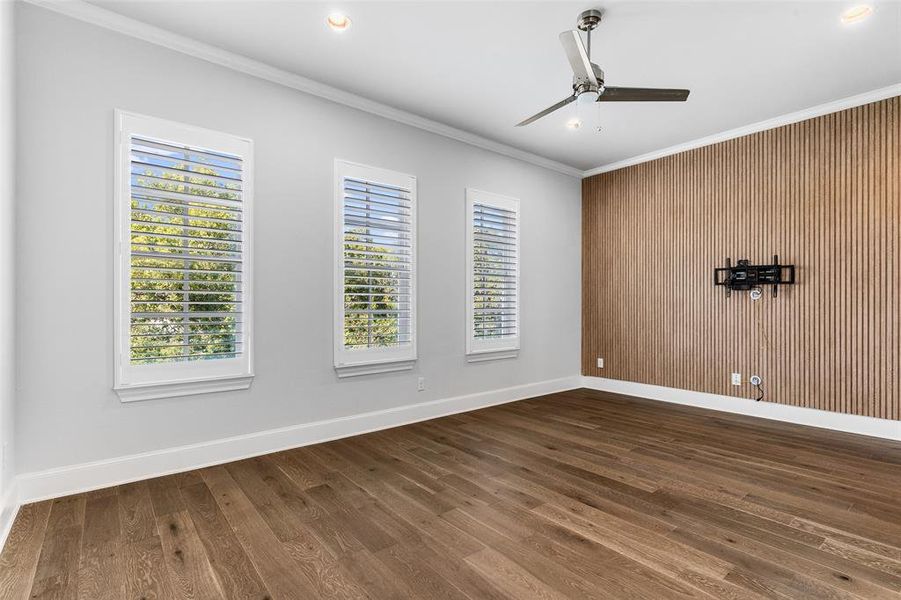 Primary Bedroom has accent wall with lighting