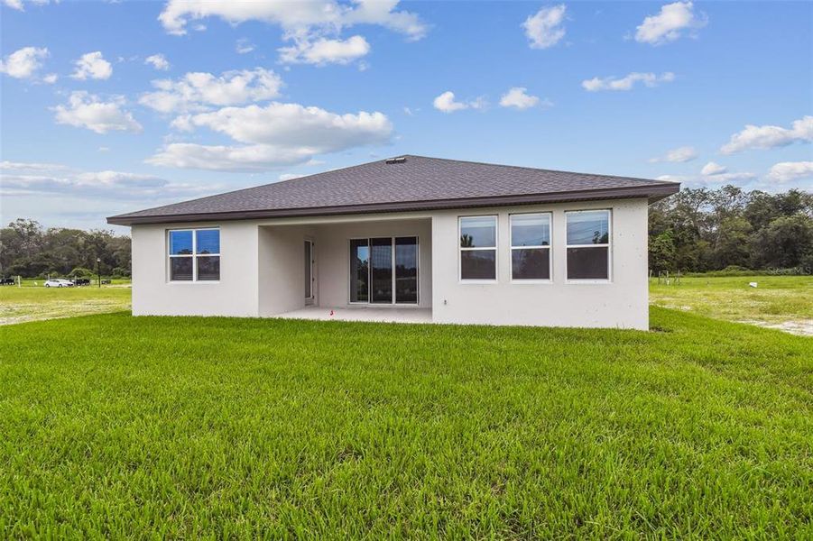 Front exterior of a new home in Hidden Ridge, New Port Richey, FL, highlighting curb appeal (Image 28). Front exterior of a new home in Hidden Ridge, New Port Richey, FL, highlighting curb appeal (Image 28).