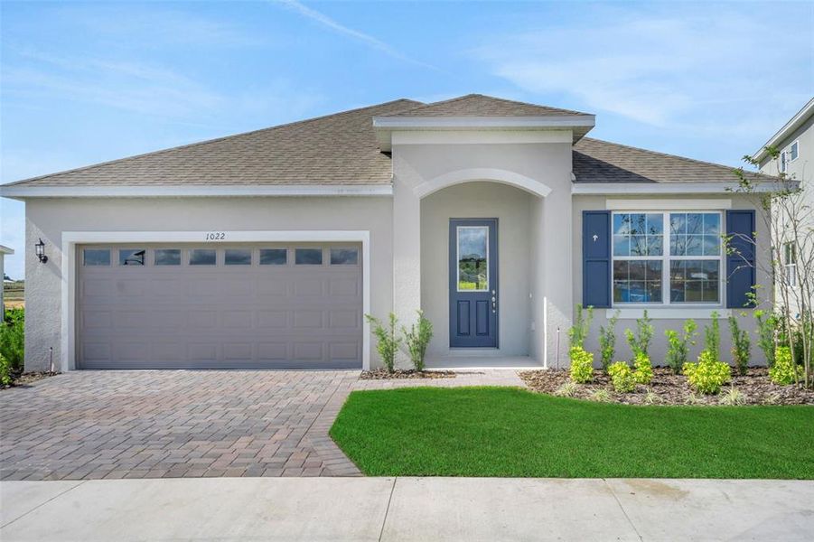 Front exterior of a new home in Reserve at Hammock Oaks, Lady Lake, FL, highlighting curb appeal (Image 20). Front exterior of a new home in Reserve at Hammock Oaks, Lady Lake, FL, highlighting curb appeal (Image 20).