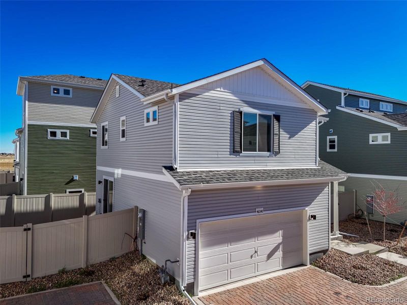 Front exterior of a new home in , Bennett, CO, highlighting curb appeal (Image 20).