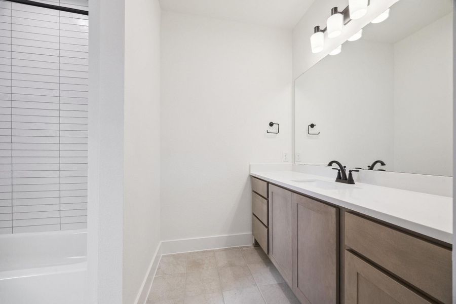 Full bathroom adjacent to first floor bedroom/office space Full bathroom adjacent to first floor bedroom/office space