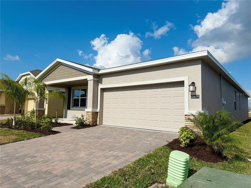Front exterior of a new home in Tohoqua, Kissimmee, FL, highlighting curb appeal (Image 1). Front exterior of a new home in Tohoqua, Kissimmee, FL, highlighting curb appeal (Image 1).