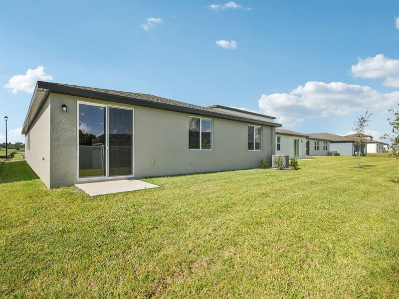 Exterior details and patio area of a home in The Grove at Stuart Crossing - Classic Series, Bartow (Image 2). Exterior details and patio area of a home in The Grove at Stuart Crossing - Classic Series, Bartow (Image 2).