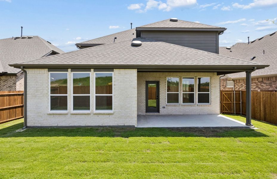 Exterior details and patio area of a home in Whitewing Trails, Princeton (Image 2).