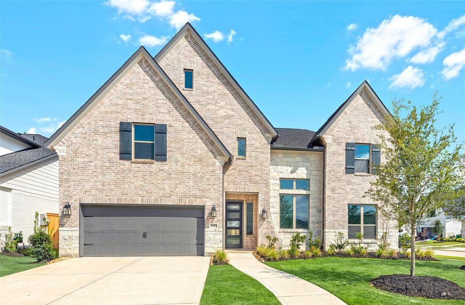Front exterior of a new home in Jordan Ranch – 60', Brookshire, TX, highlighting curb appeal (Image 1). Front exterior of a new home in Jordan Ranch – 60', Brookshire, TX, highlighting curb appeal (Image 1).