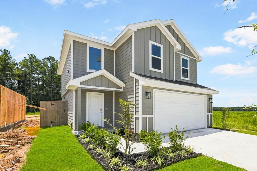 Front exterior of a new home in The Canopies, Splendora, TX, highlighting curb appeal (Image 1). Front exterior of a new home in The Canopies, Splendora, TX, highlighting curb appeal (Image 1).