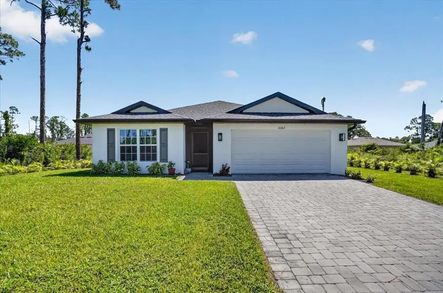 Front exterior of a new home in , North Port, FL, highlighting curb appeal (Image 25). Front exterior of a new home in , North Port, FL, highlighting curb appeal (Image 25).