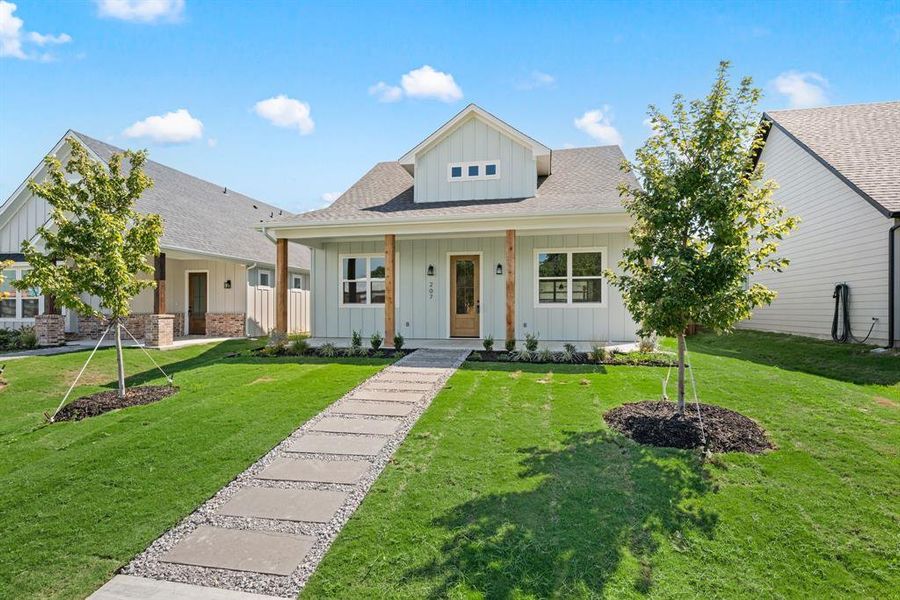 Front exterior of a new home in , Justin, TX, highlighting curb appeal (Image 23).