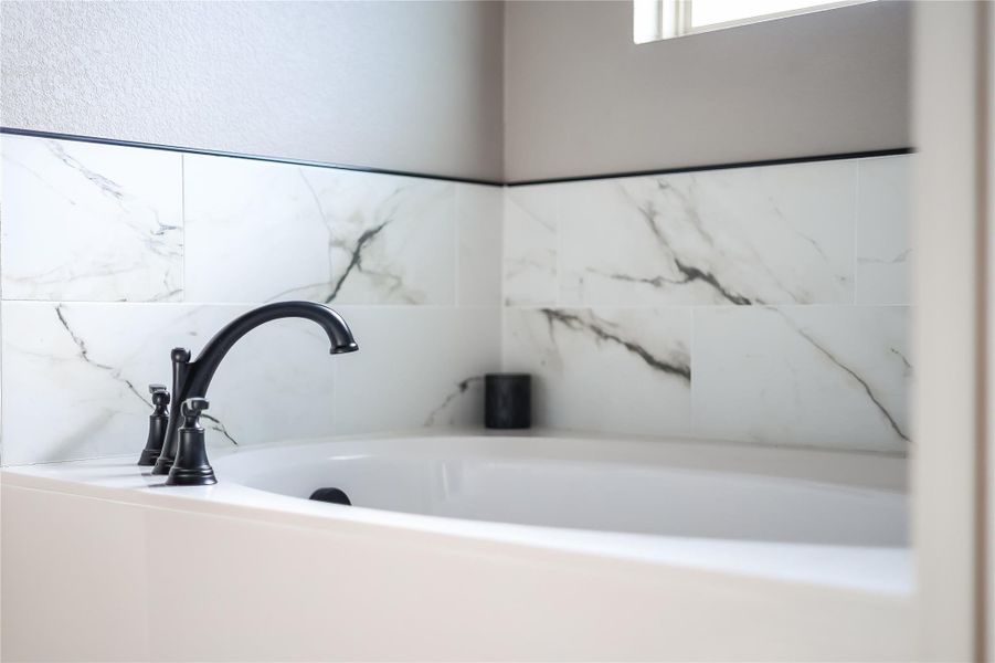 Bathroom view of a sink and a garden tub Bathroom view of a sink and a garden tub