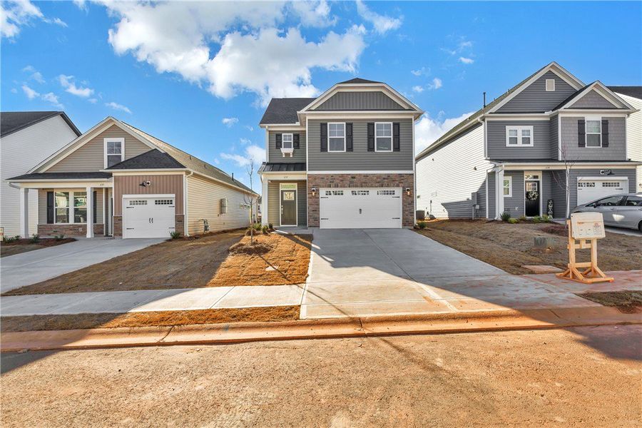 Front exterior of a new home in Brownstone Park, Easley, SC, highlighting curb appeal (Image 2).