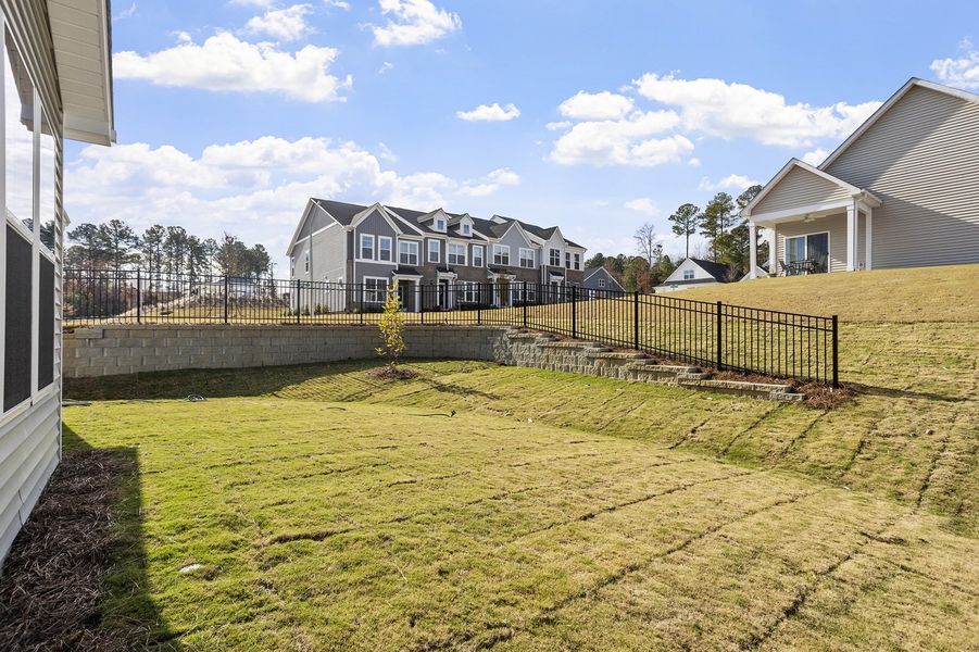 Exterior details and patio area of a home in Renaissance at White Oak, Garner (Image 4).