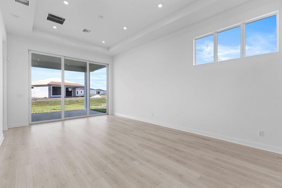 Furnished interior view inside a new home in PGA Village Verano, Port St. Lucie (Image 9).