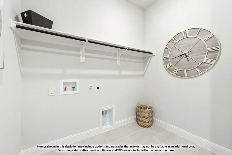 Laundry room with upper shelf, hanging rod, washer hookups, and tile flooring