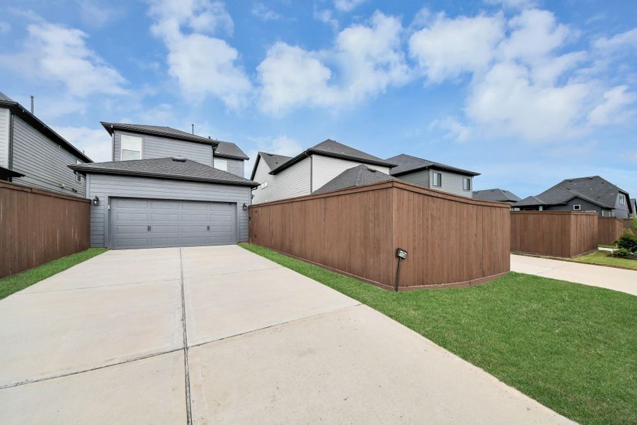 Front exterior of a new home in The Groves 35', Humble, TX, highlighting curb appeal (Image 2). Front exterior of a new home in The Groves 35', Humble, TX, highlighting curb appeal (Image 2).